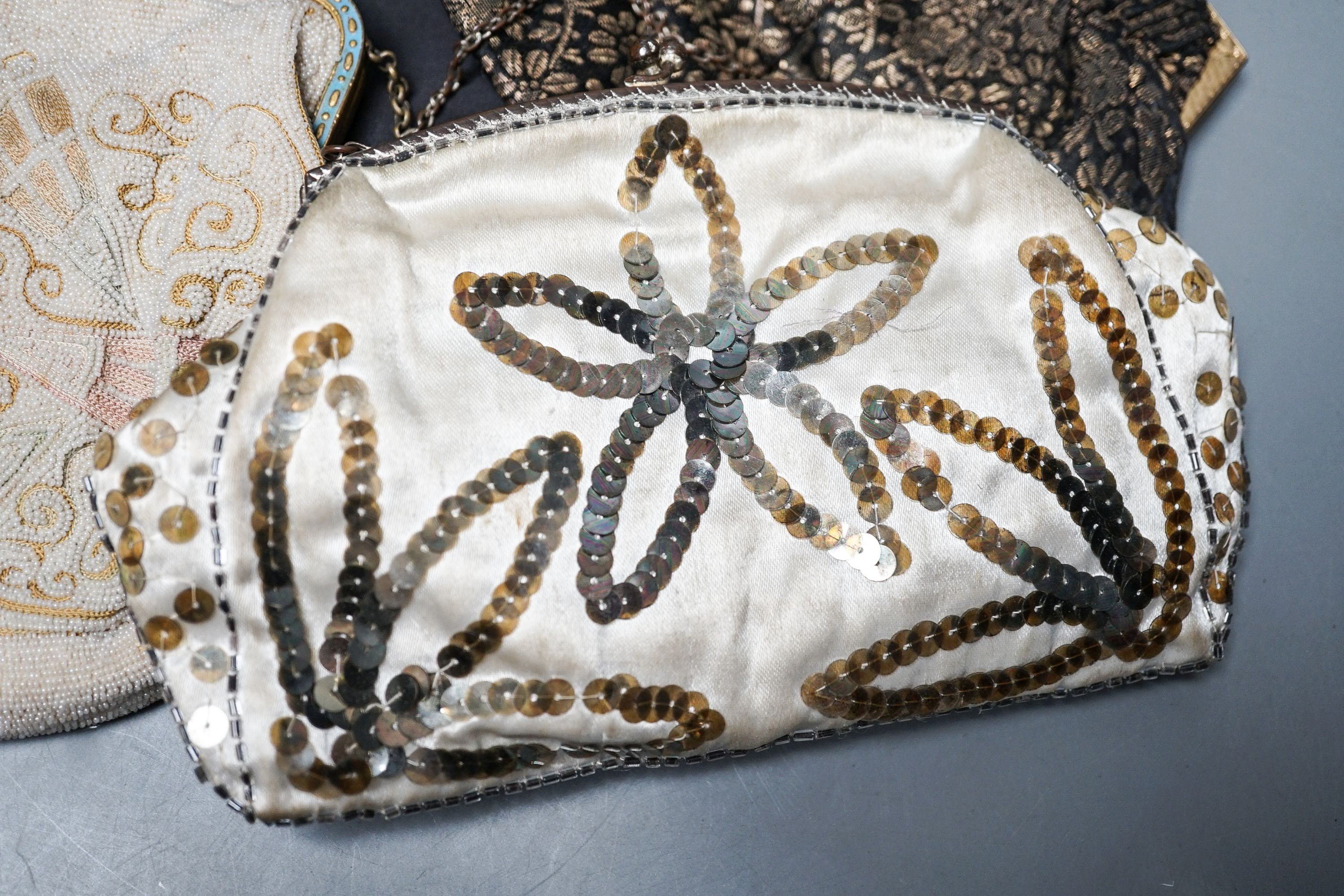 A beaded and embroidered evening bag, a similar sequinned bag and two others
